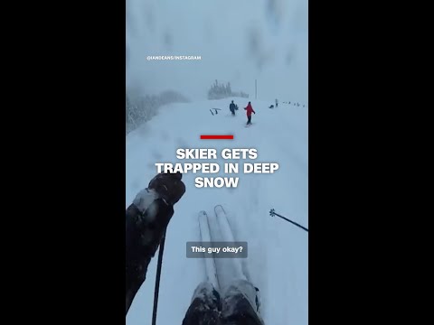 Skier gets trapped in deep snow