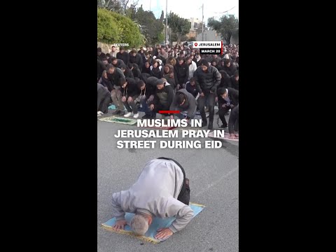 Muslims pray in streets of Jerusalem during Eid