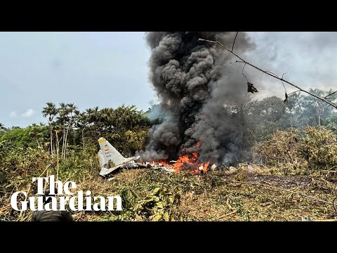 Wreckage burns at site of fatal Colombian military plane crash