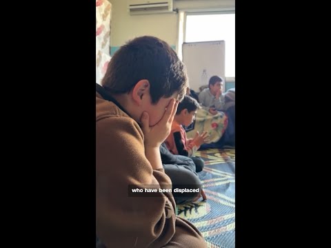 Displaced families in Beirut shelter in school