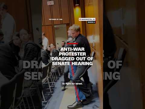 Anti-war protester dragged out of Senate hearing