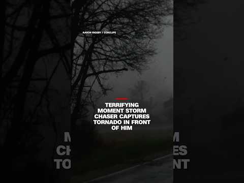 Terrifying moment storm chaser captures tornado in front of him
