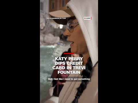 Katy Perry dips credit card in Trevi fountain