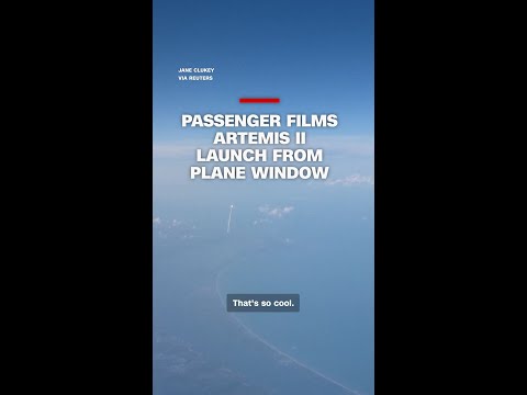 Passenger films Artemis II launch from plane window