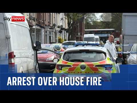Woman held after two young children die in house fire