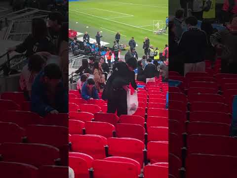 Japan fans seen clearing up after Wembley win