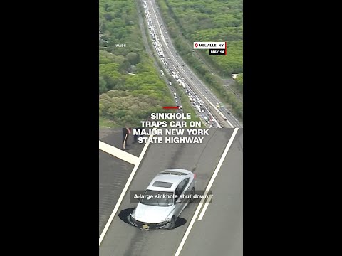 Sinkhole traps car on major New York state highway