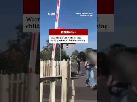 Warning issued after woman and child dash over level crossing. #England #BBCNews