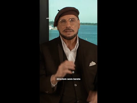 John Travolta speaks to CNN about his Cannes beret look