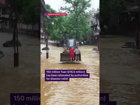 Deadly floodwaters sweep car away in China