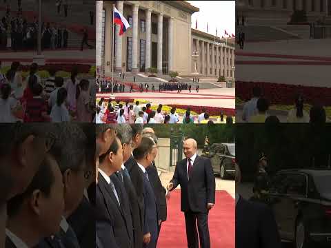 Xi and Putin shakehands before summit In Beijing