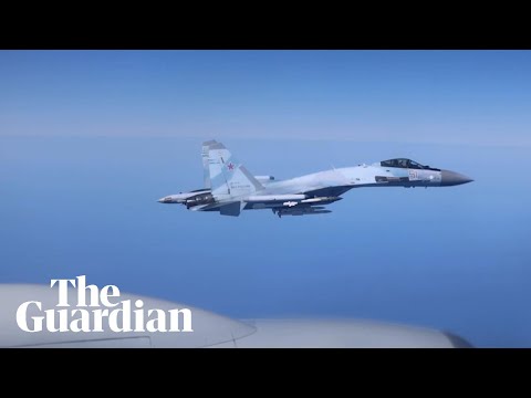 Russian jet filmed flying within metres of RAF spy plane