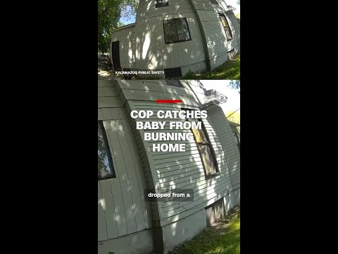 Cop catches baby tossed from burning home