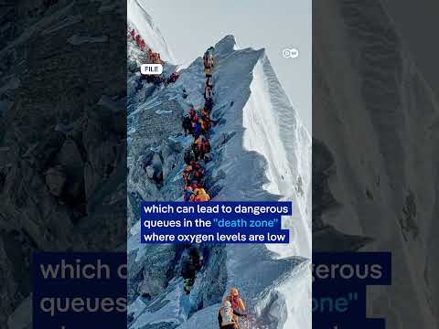 Mount Everest hits record single-day summit numbers from Nepal side | DW News