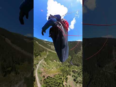 Moment paraglider and plane collide in skies over Alps