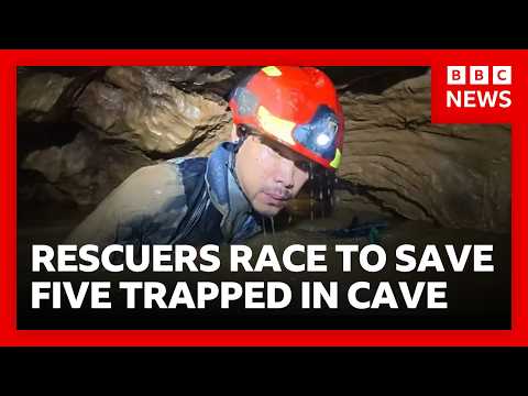 Rescuers race to free five people trapped in flooded cave in Laos | BBC News
