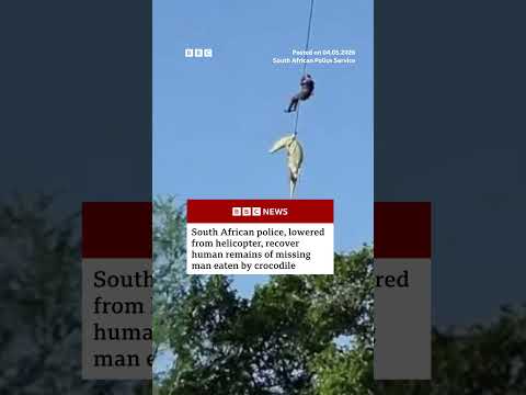 Police officer lowered into crocodile-infested river to recover human remains. #SouthAfrica #BBCNews