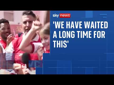 Crowds of jubilant fans attend Arsenal parade in North London