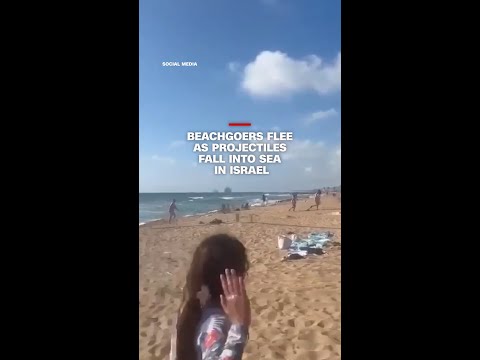 Beachgoers flee as projectiles fall into sea in Israel