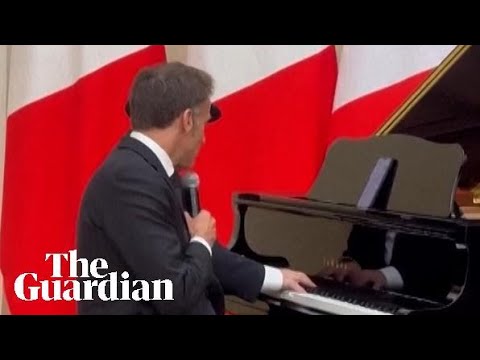 Macron sings as Armenia’s prime minister plays the drums during official dinner