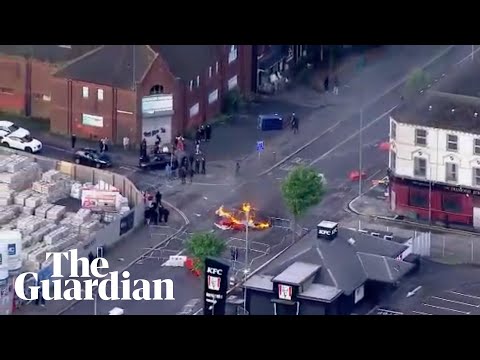 Aerials from Belfast during anti-immigration protest following knife attack – watch live