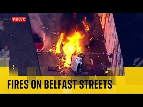 Disorder in Belfast as cars and buses burn following knife attack