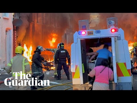 Belfast residents run from burning homes as violence erupts after protests