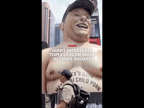 Giant inflatable topless Elon Musk in Times Square