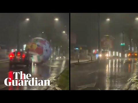 Giant World Cup ball blows through streets of San Salvador