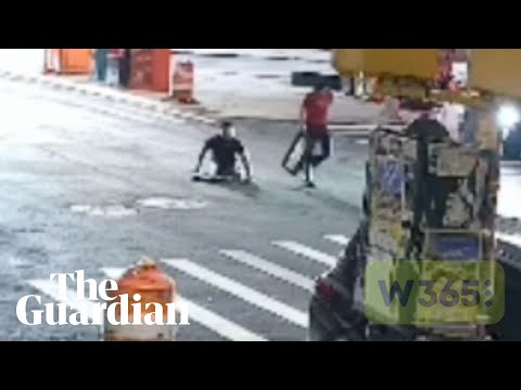 People emerge from New York City manhole