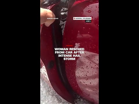 Woman rescued from car after intense hail storm