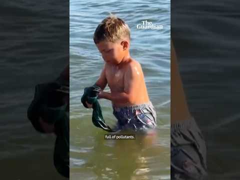 ‘The heat is killing us’: Palestinians cool off in polluted sea during hot weather