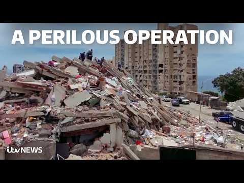 Watch rescuers work to free man from collapsed car park days after Venezuela quakes