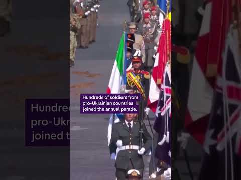Zelenskyy hugs Macron at Bastille Day celebrations