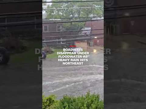 Roadways disappear under floodwater as heavy rain hits northeast