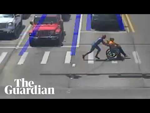 Driver dressed as Spider-Man helps man in wheelchair cross road