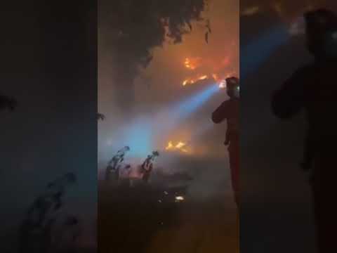 Spain’s military firefighters work to defend wildfires ripping through the country