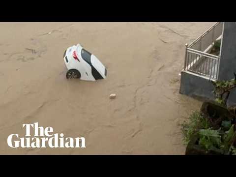 Cars swept away and trees toppled as Typhoon Noul brings flooding to southern China