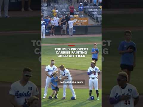 Top MLB prospect carries fainting child off field