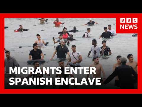 Thousands of migrants try to enter Spanish enclave of Ceuta from Morocco | BBC News
