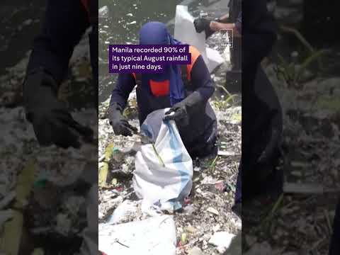 Clear up begins in Philippines river filled with rubbish after heavy rain and flooding