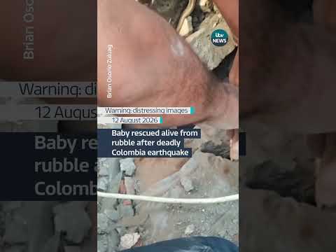 Rescuers pull a baby from the rubble of collapsed a building in Cali.
