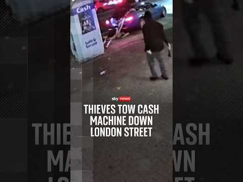 Thieves tow cash machine down London street