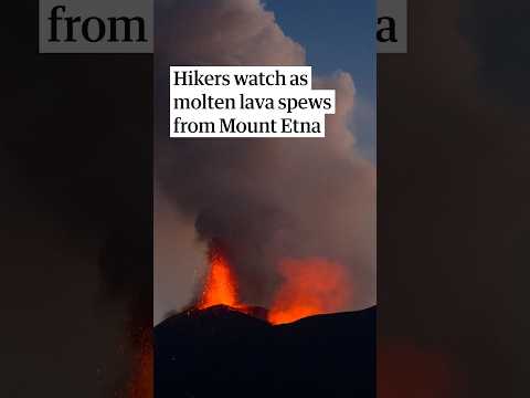 Molten lava spews from Mount Etna