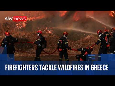 Firefighters tackle wildfires in Athens