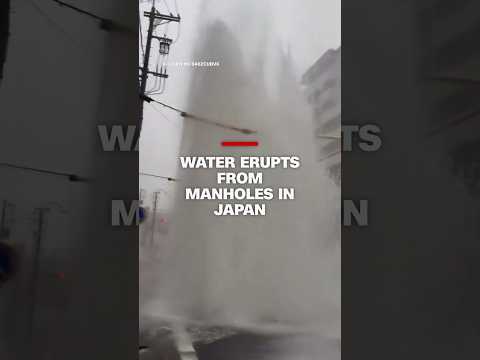 Water erupts from manholes in Japan