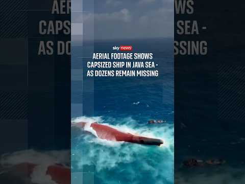 Aerial footage shows capsized ship in Java Sea – as dozens remain missing