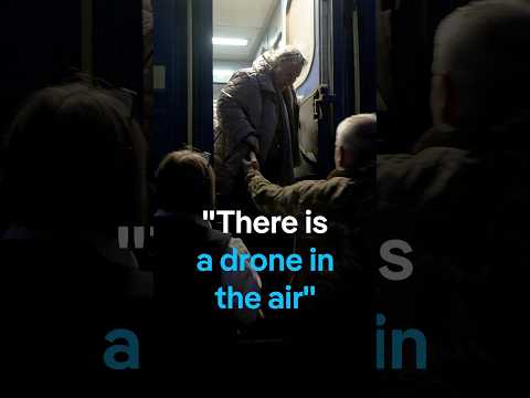 Drone alert: DW team films night-time evacuation of Ukrainian train | DW News