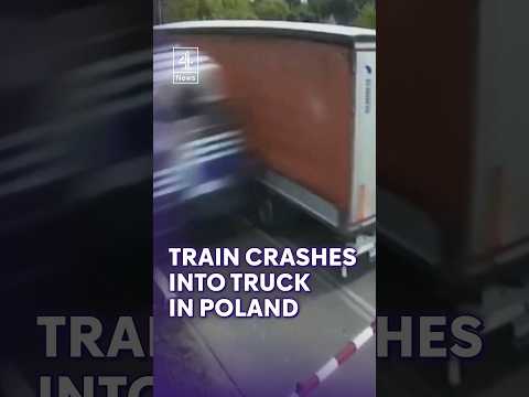 Moment train crashes into truck’s trailer stuck on tracks in Poland