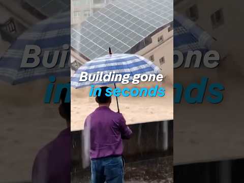 Watch floodwaters swallow an entire building in seconds | DW News